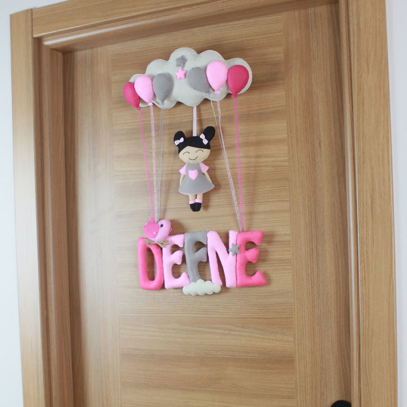 Kız bebek kapı süsü, bulut ve fil figürü detayları