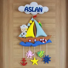 Denizci bebek kapı süsü isimli bulut ve yelkenli gemi detayı