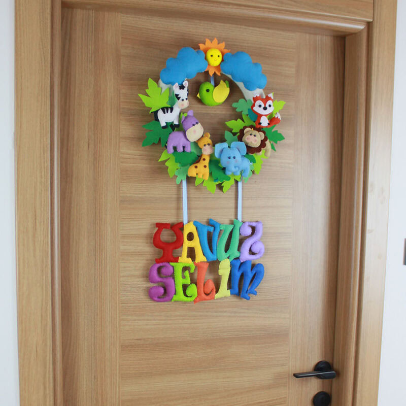 Keçe güneş, bulut ve tilki figürlü kapı süsü üst bölüm detayı